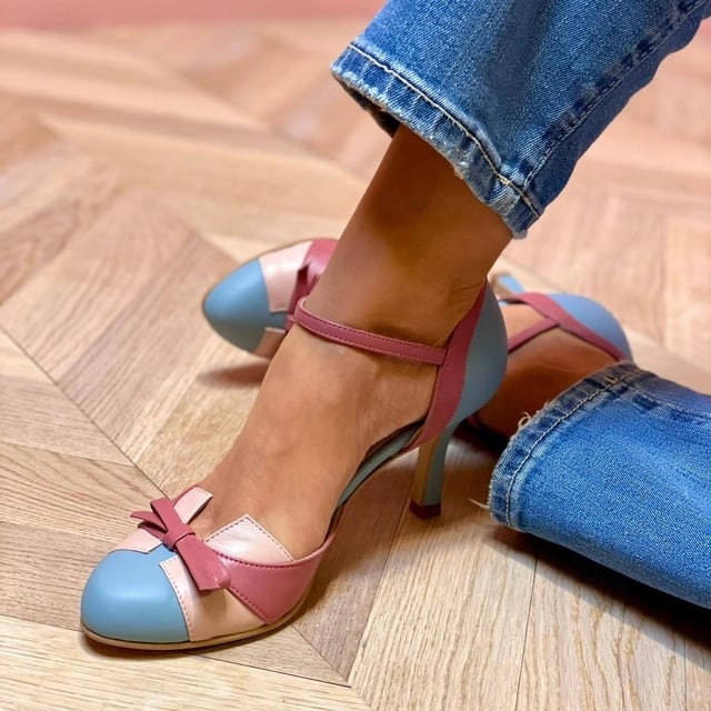 Donna elegant stiletto heel sandals in a soft pastel colorway, side profile view showing cushioned insole and slender heel