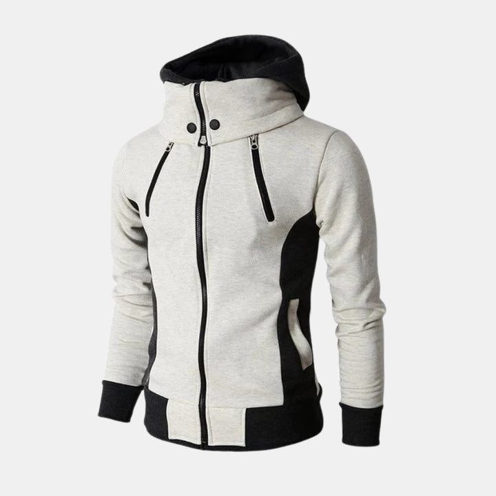 Woman wearing the Dorian Sport Jacket in white, featuring a high-neck hood and contrast details, styled for an athletic look