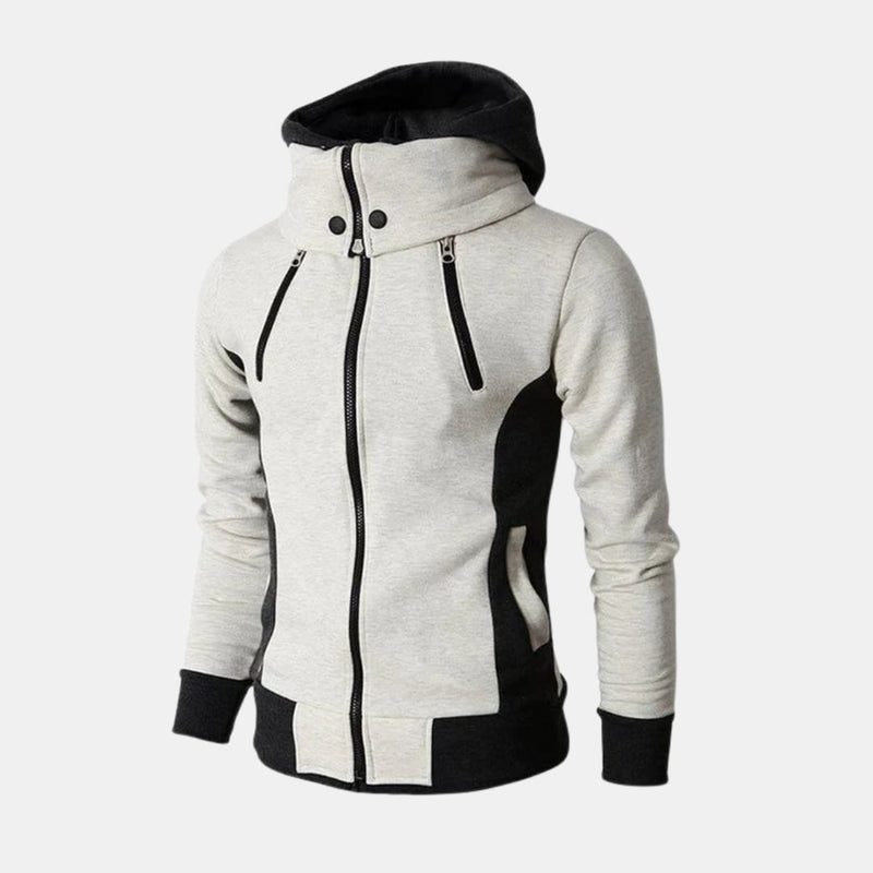 Woman wearing the Dorian Sport Jacket in white, featuring a high-neck hood and contrast details, styled for an athletic look