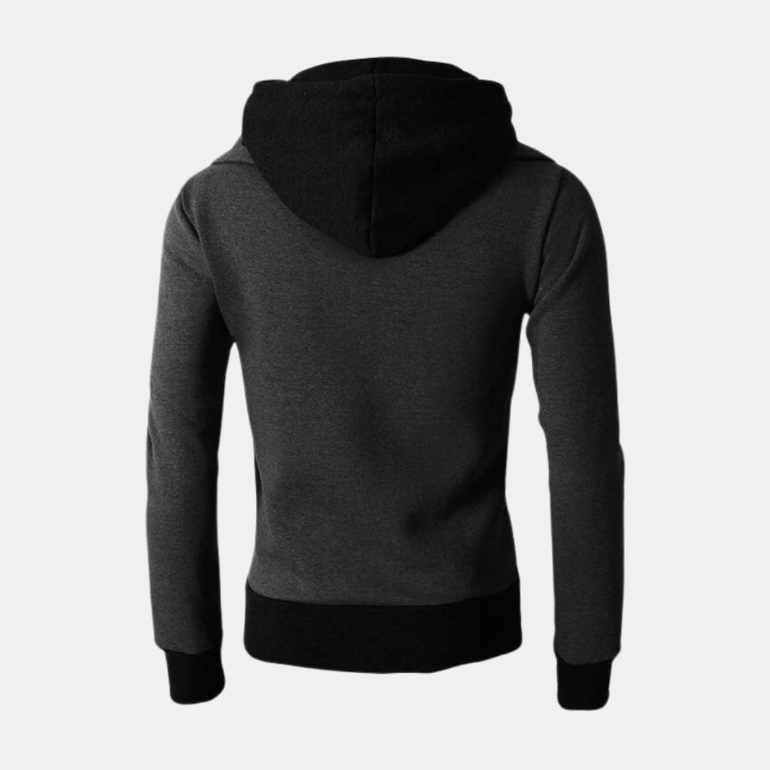 Woman wearing the Dorian Sport Jacket in black with a high-neck hood pulled up for extra wind protection