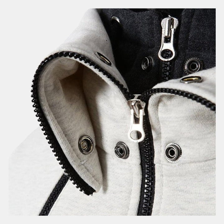 Flat lay of the Dorian Sport Jacket in all three colorways: White, Grey, and Black