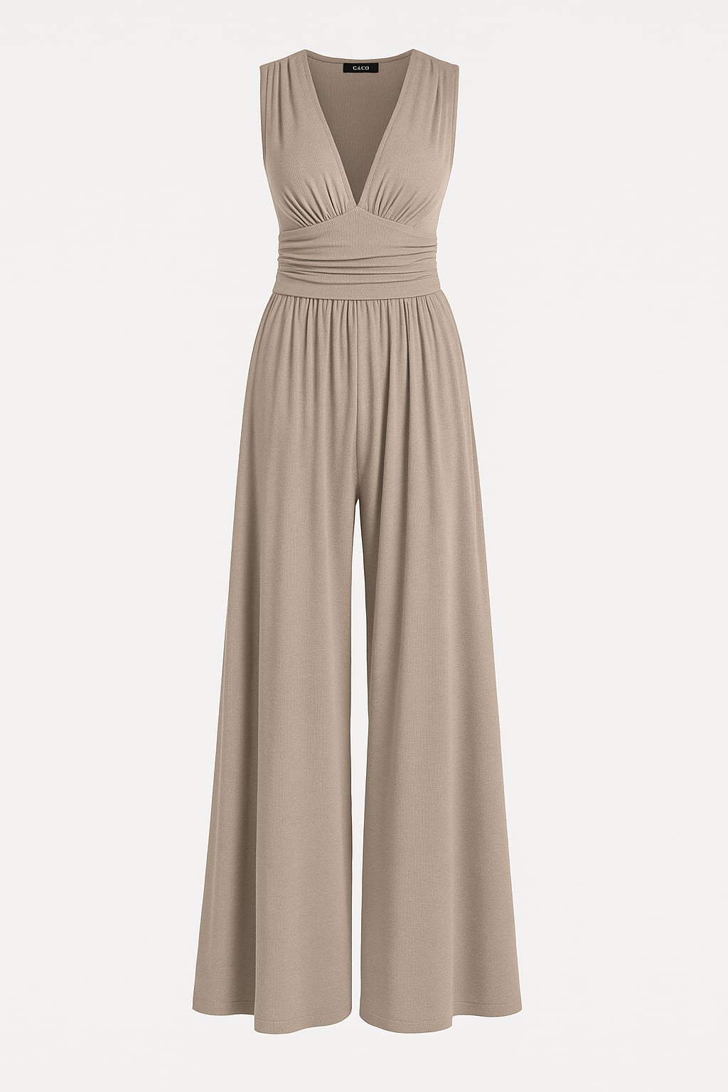 Side view of a woman wearing a navy wide-leg jumpsuit highlighting the defined waist and elongated leg line