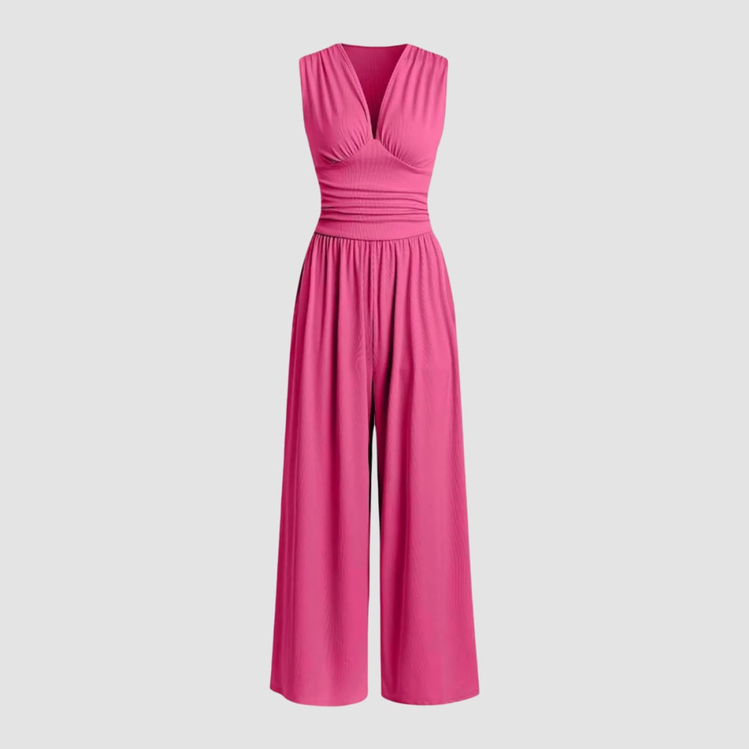 Front view of a green wide-leg stretch jumpsuit on a model showing full-length silhouette