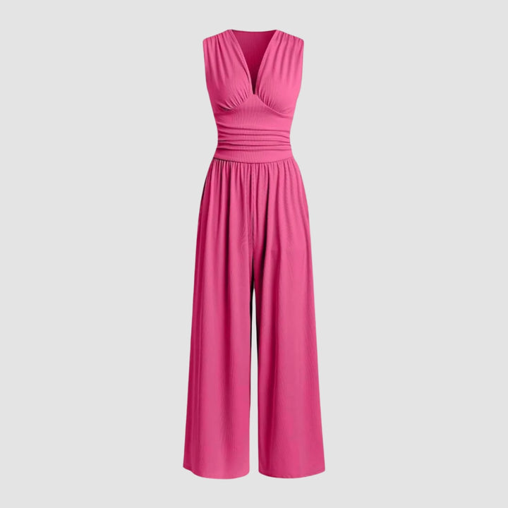 Front view of a green wide-leg stretch jumpsuit on a model showing full-length silhouette