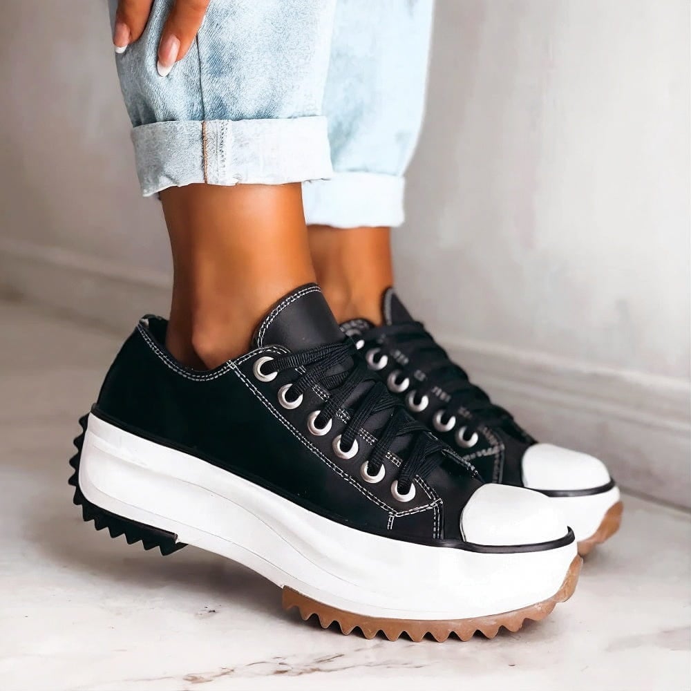 Front view of Dorothy women's sneakers in black with cushioned sole and clean low-top silhouette