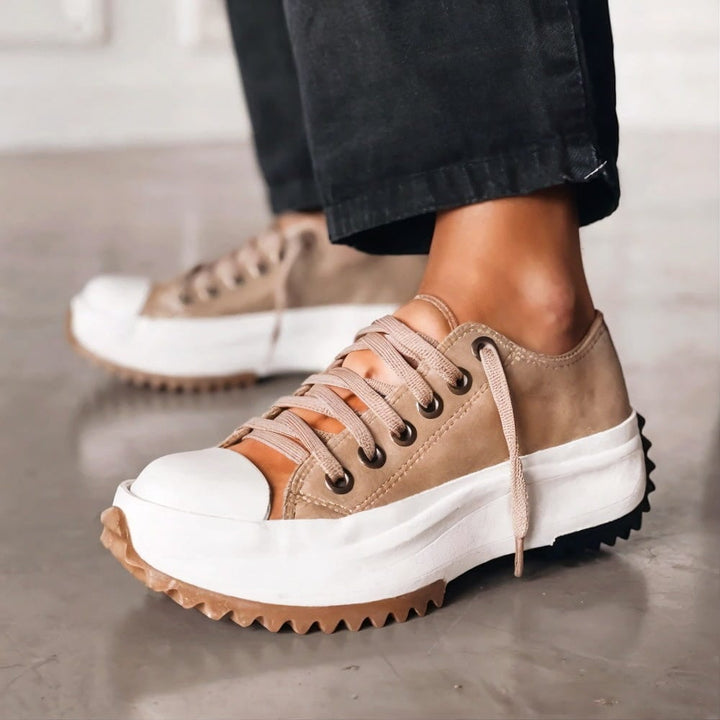 Side profile of Dorothy women's sneakers showing arch support design and lightweight construction