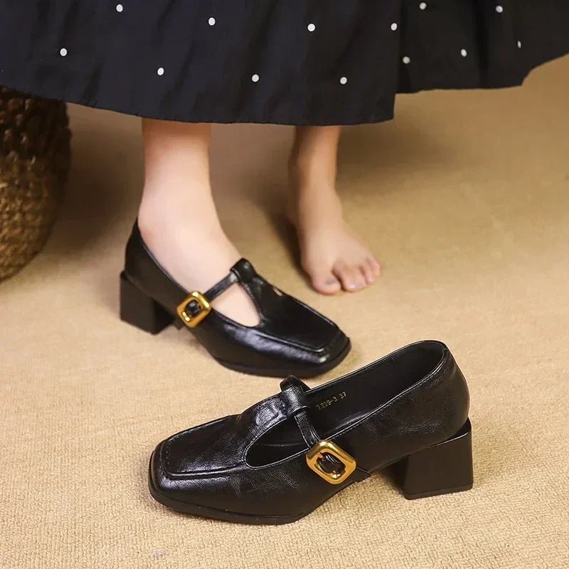 Pair of Odette square toe mary jane heels in brown and black displayed side by side on neutral background