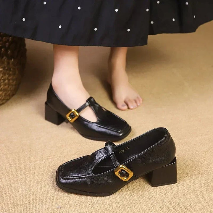 Pair of Odette square toe mary jane heels in brown and black displayed side by side on neutral background