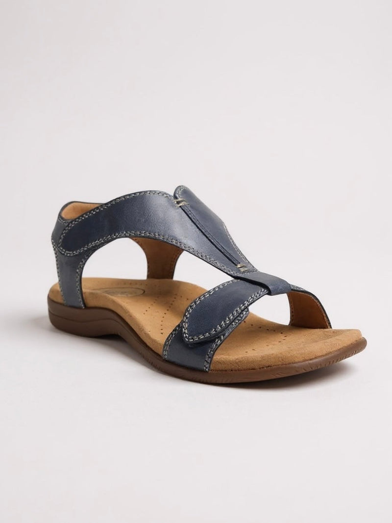 Dove flat T-strap sandal shown from the side highlighting the lightweight sole