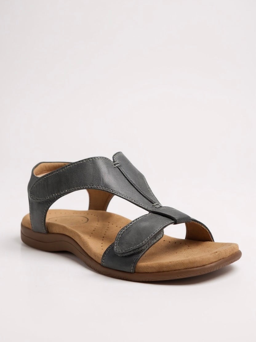 Lifestyle shot of the Dove cushioned T-strap sandal being worn with a casual summer outfit