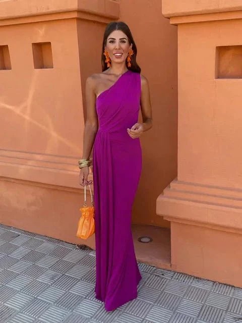 Side view of the Dove wedding guest dress highlighting the fluid drape and flattering silhouette