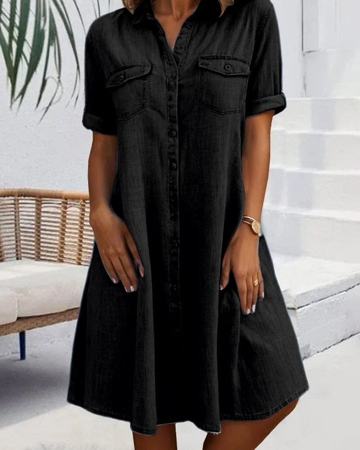 Front view of the lightweight denim-look dress in light blue showing button-down detail
