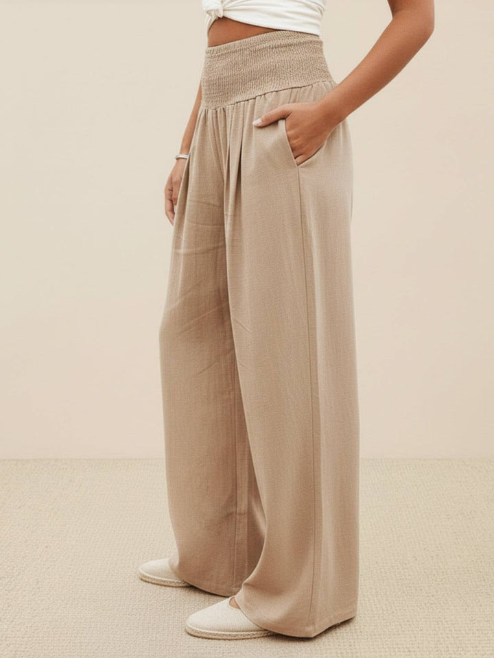 Side view of khaki wide leg linen-look pants showing full-length flowing silhouette