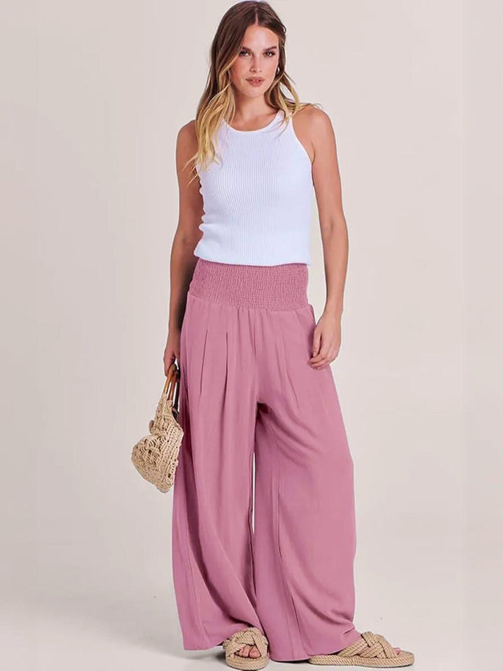 Back view of light pink wide leg smocked waistband pants