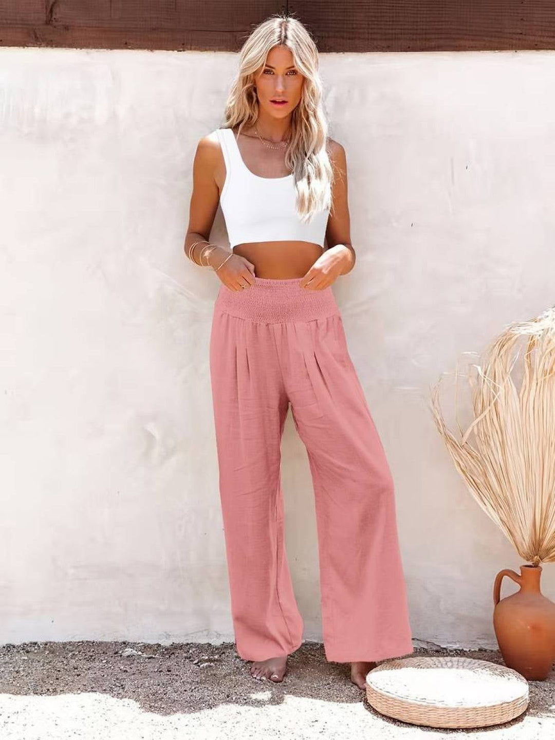 Front view of army green high waist wide leg smocked pants