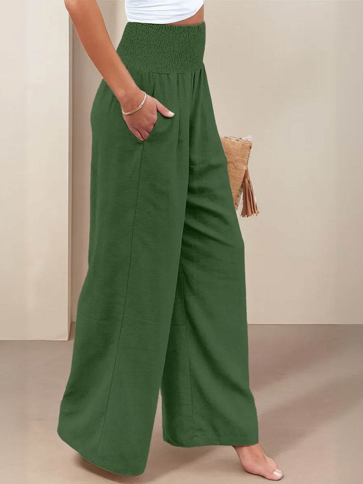 Front view of black high waist wide leg smocked linen-look pants