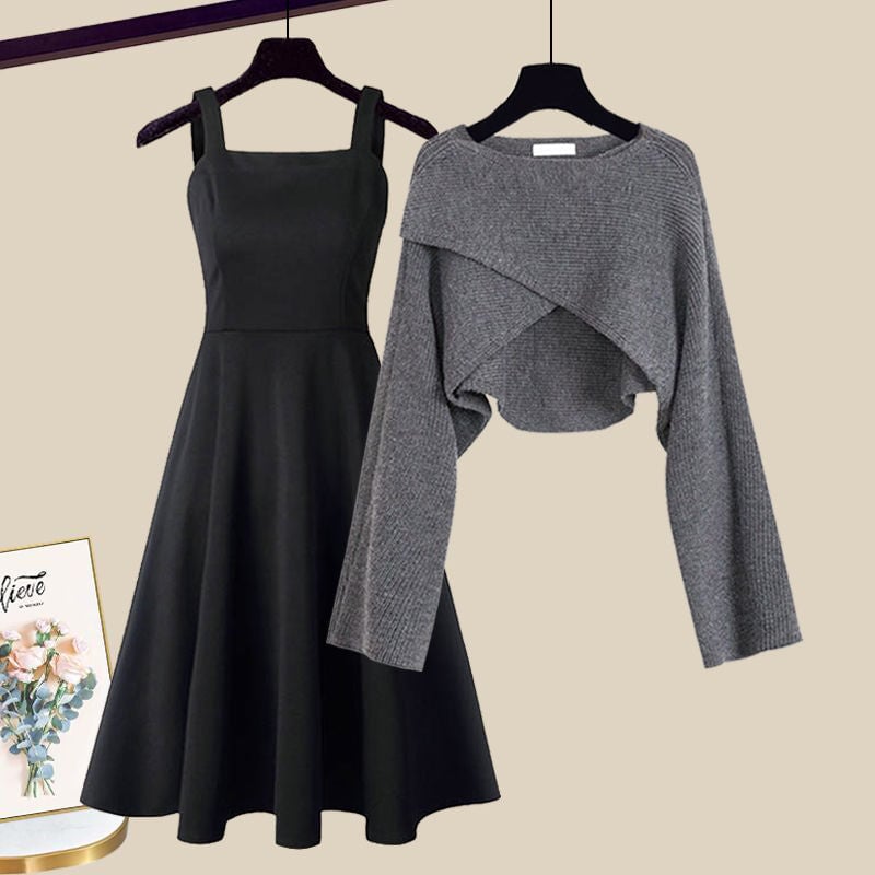 Grey knit 2-in-1 A-line dress and cropped sweater set laid flat on a neutral background