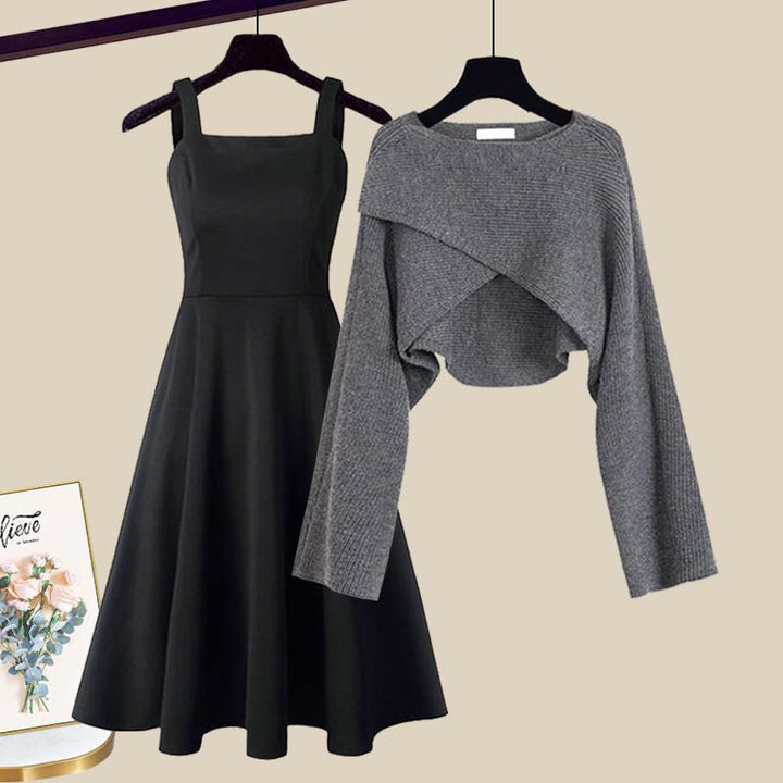 Grey knit 2-in-1 A-line dress and cropped sweater set laid flat on a neutral background