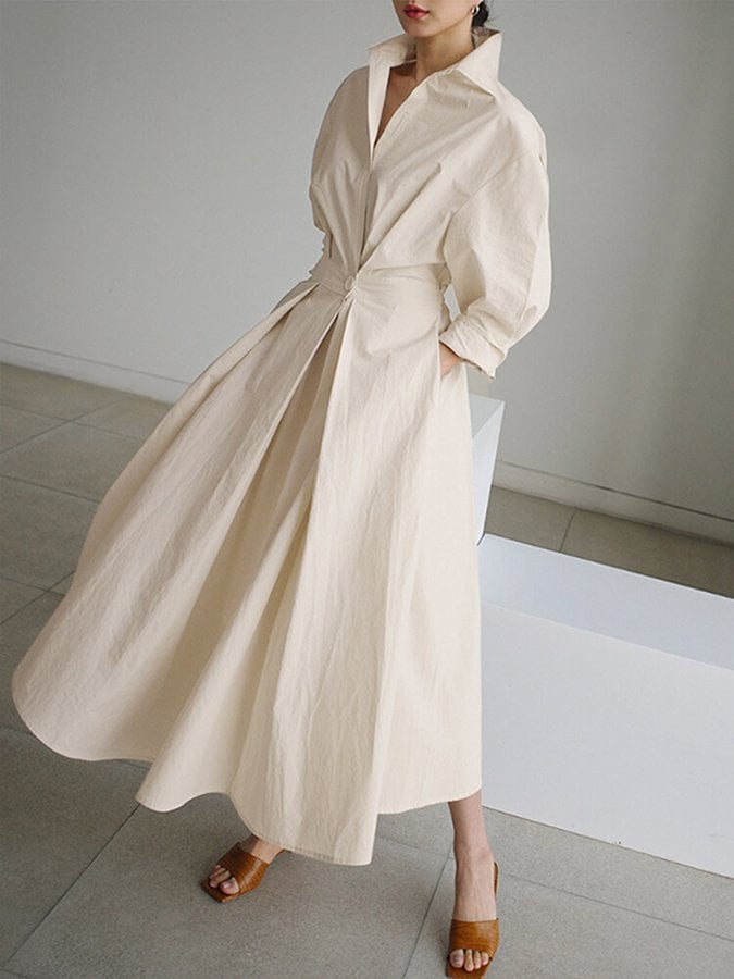Front view of the Eden elegant long dress in black with a graceful, airy drape