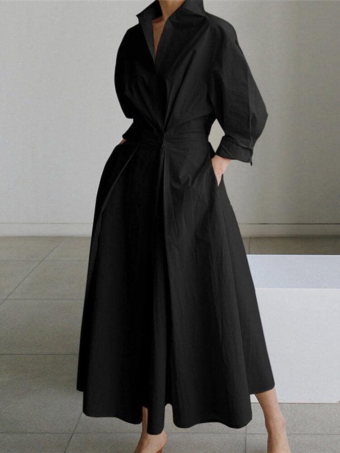 Model posing in the Eden elegant long dress in beige styled with heels for an evening look