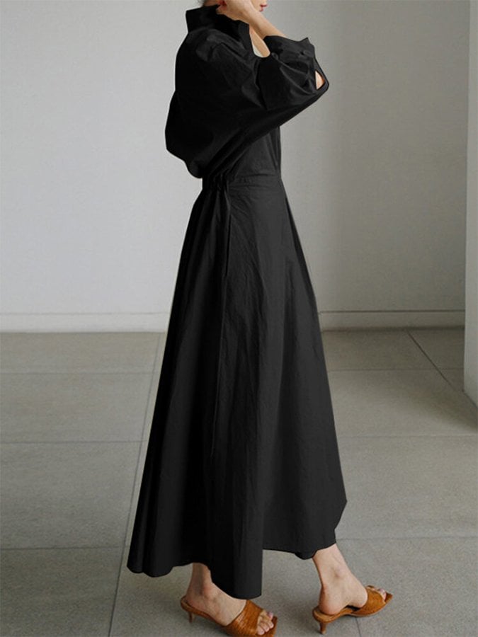 Model wearing the Eden elegant long dress in army green styled casually with sneakers