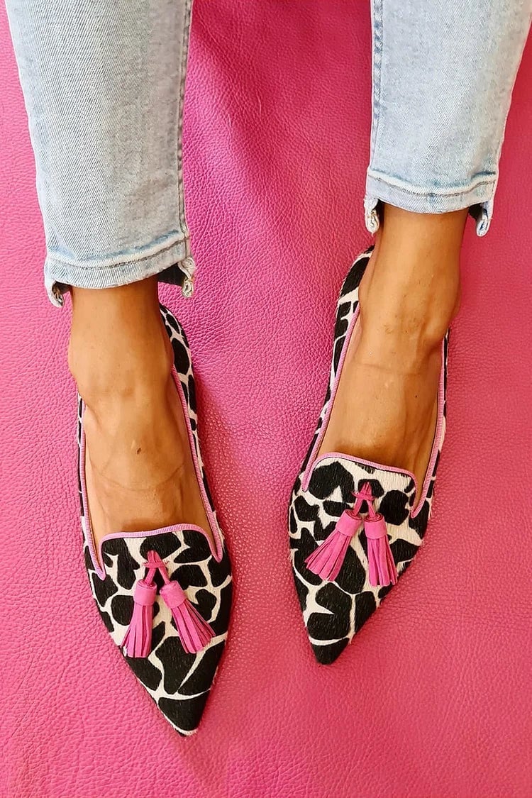 Overhead flat-lay of Eden pointed-toe loafers in green, pink, and black colorways