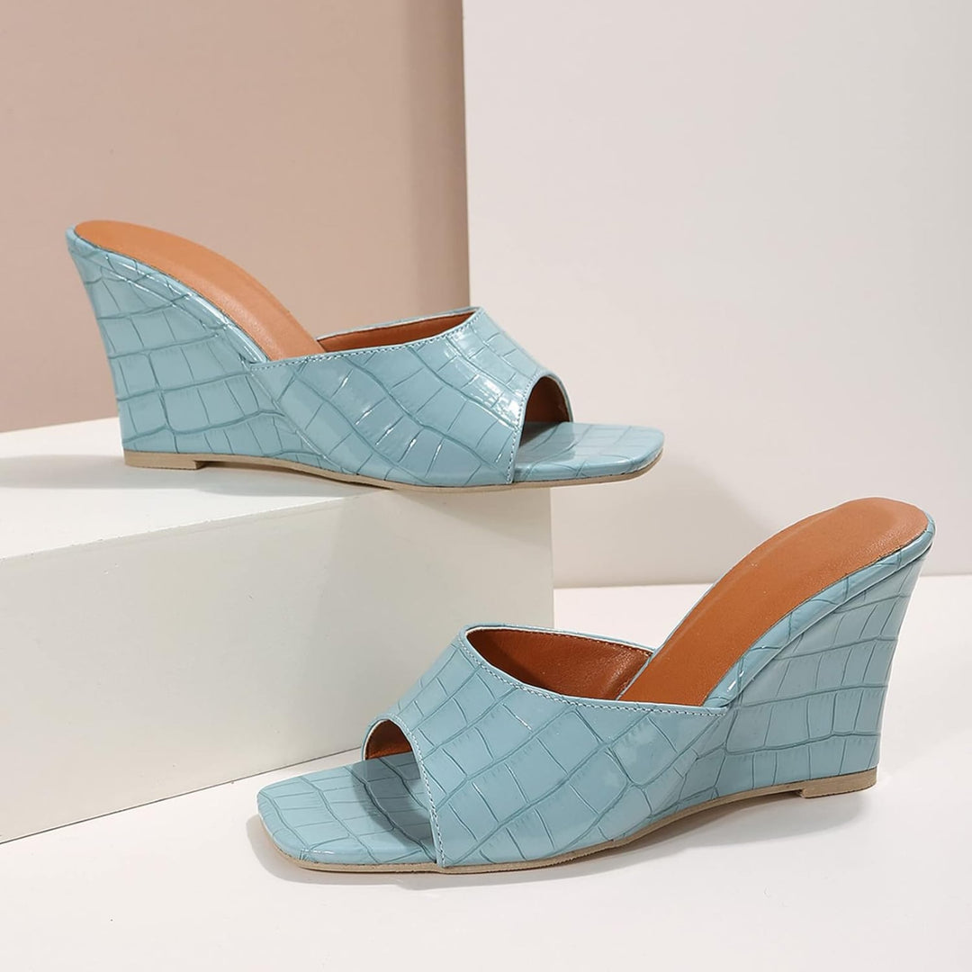 Side profile of Eden wedge shoe showing stable wedge heel and strap detail