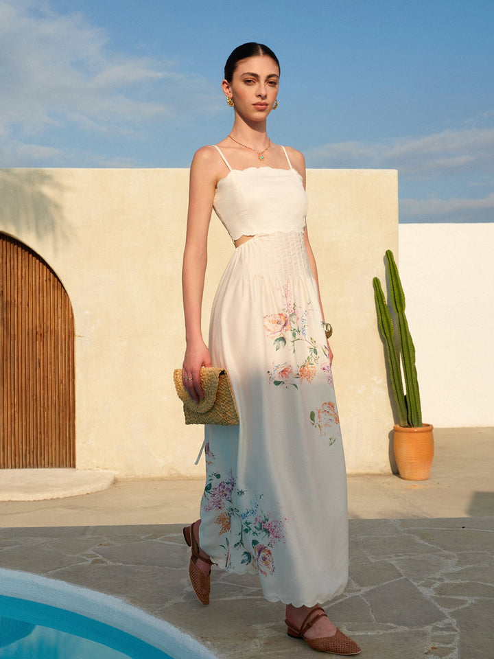 Close-up of the large-scale botanical floral print and scalloped hem on the Eden maxi dress in apricot