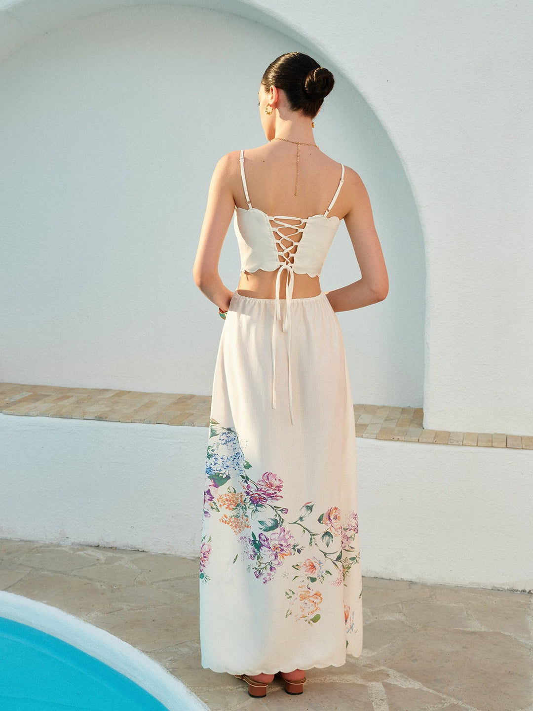 Detail shot of the adjustable straps and structured bandeau bodice on the Eden floral maxi dress