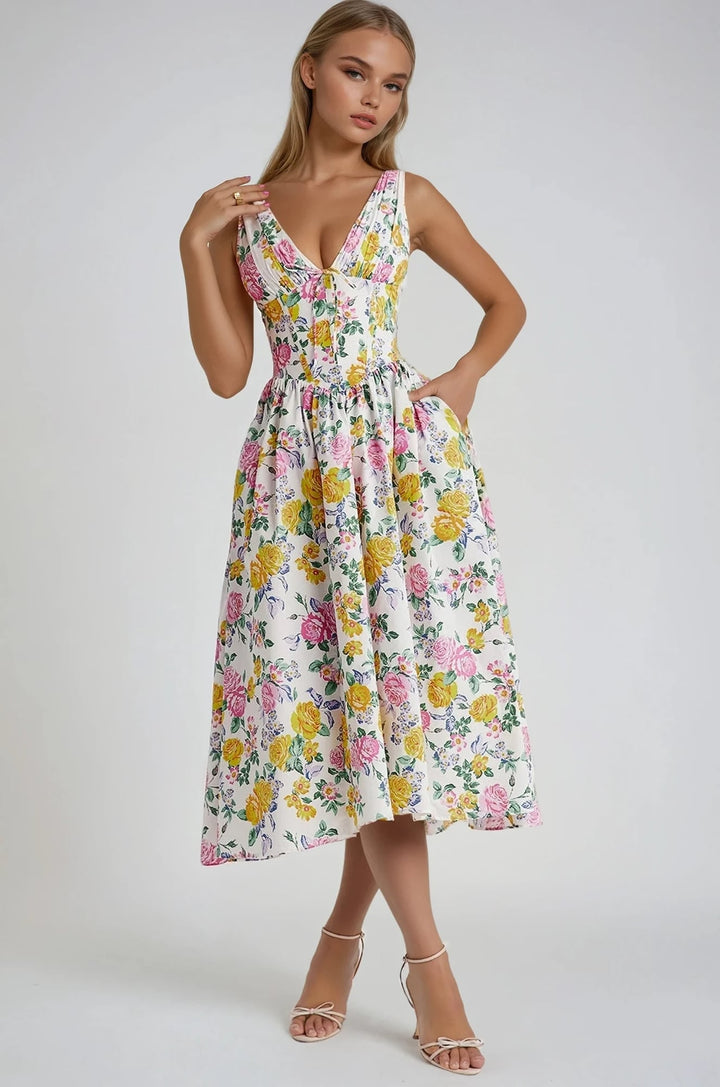 Model wearing the Edith elegant summer dress in yellow floral print, flowing silhouette, styled for a sunny day