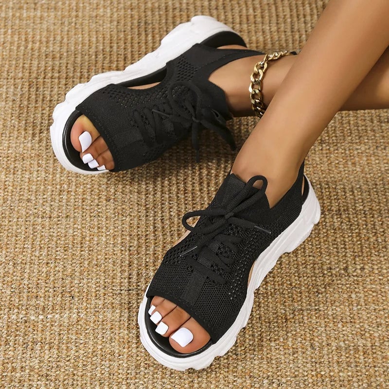 Close-up of the contoured orthopedic footbed on Effie cushioned sandals in black