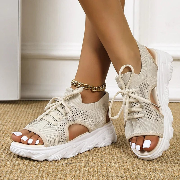 Effie orthopedic sandals in black laid flat on a light background