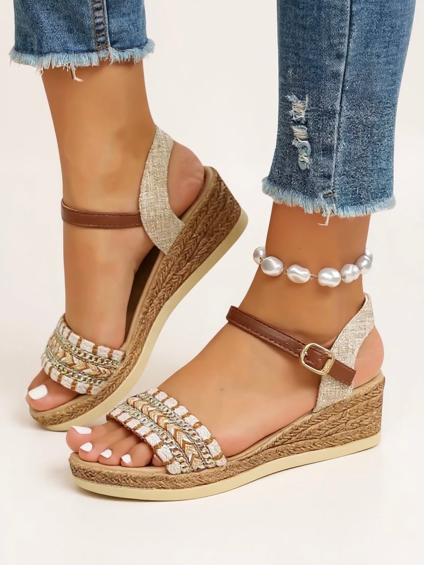 Effie beige woven wedge sandals styled on feet showing full silhouette and fit