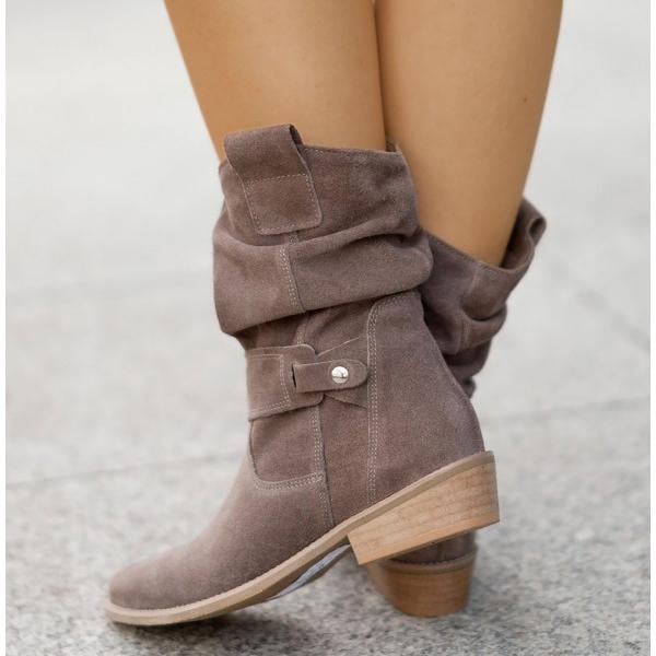Eileen ankle boots in Alabaster Beige styled with cropped trousers on a model