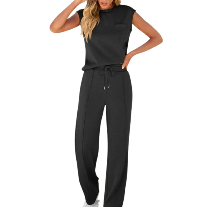 Woman wearing a relaxed soft lounge co-ord set in a neutral color, showing the full matching top and bottom outfit