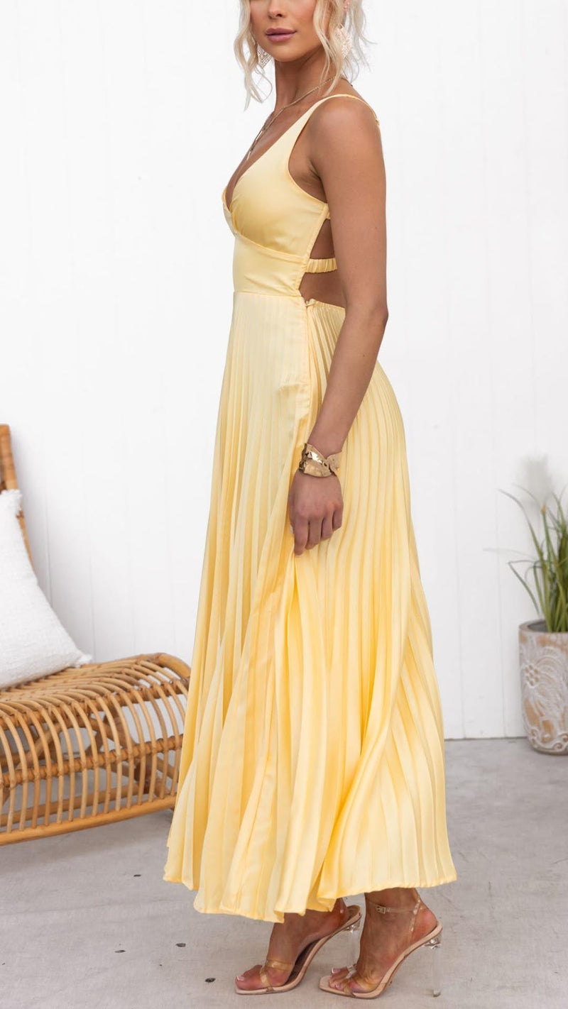 Close-up of cinched waist and soft pleats on yellow maxi dress
