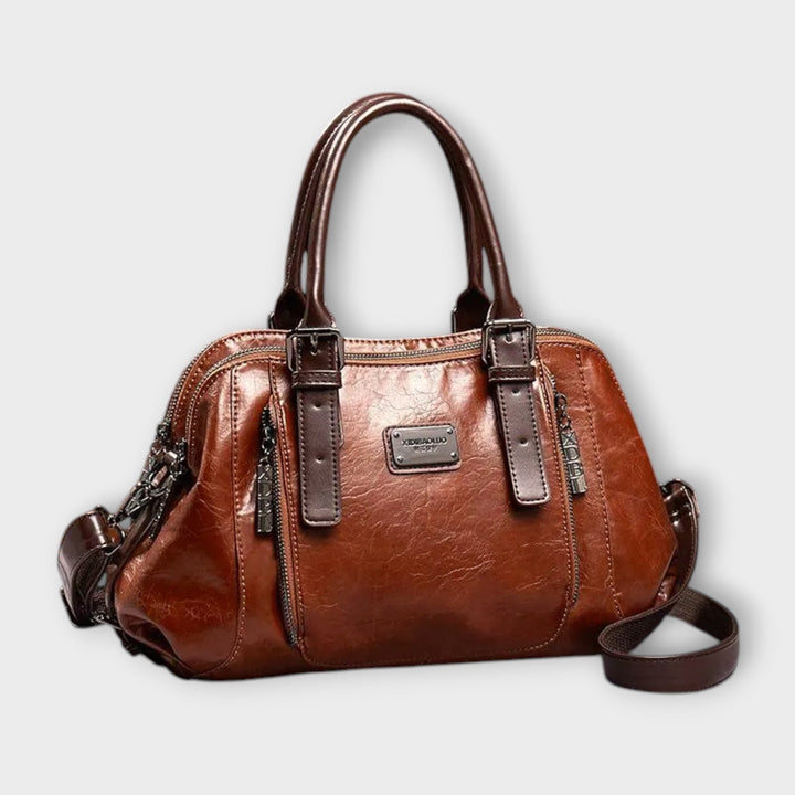 Eirunn classic structured handbag in brown with top handles and adjustable shoulder strap