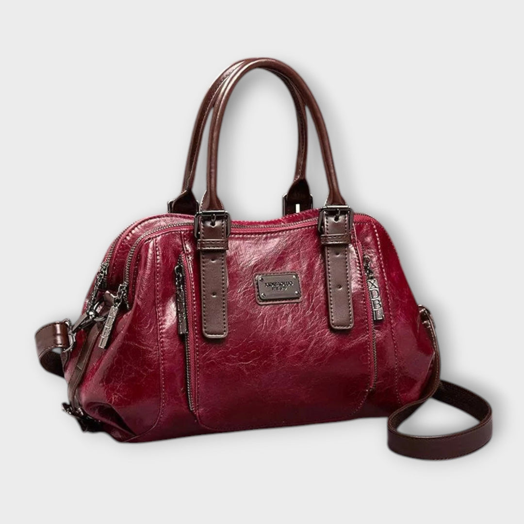 Eirunn classic handbag in red displayed against a neutral background