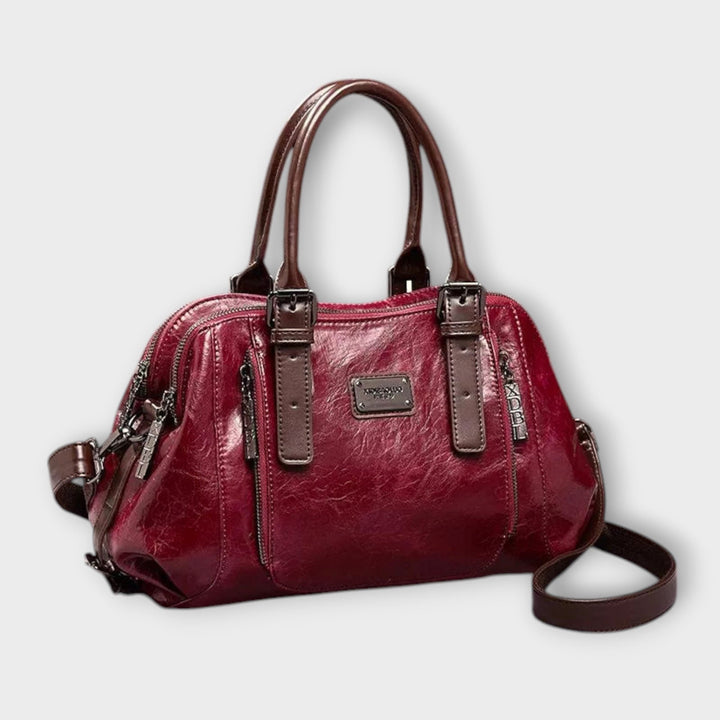 Eirunn classic handbag in red displayed against a neutral background