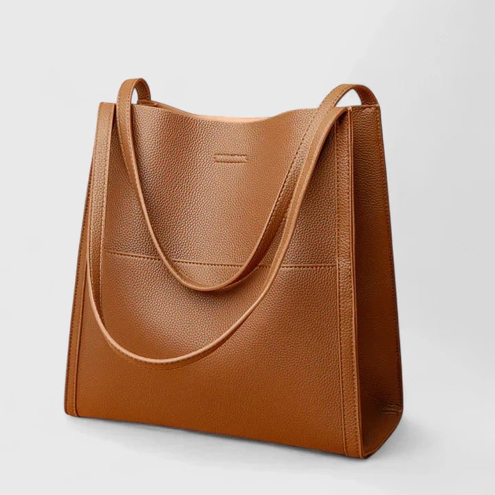 Eirunn structured handbag in green displayed at an angle to highlight its firm shape