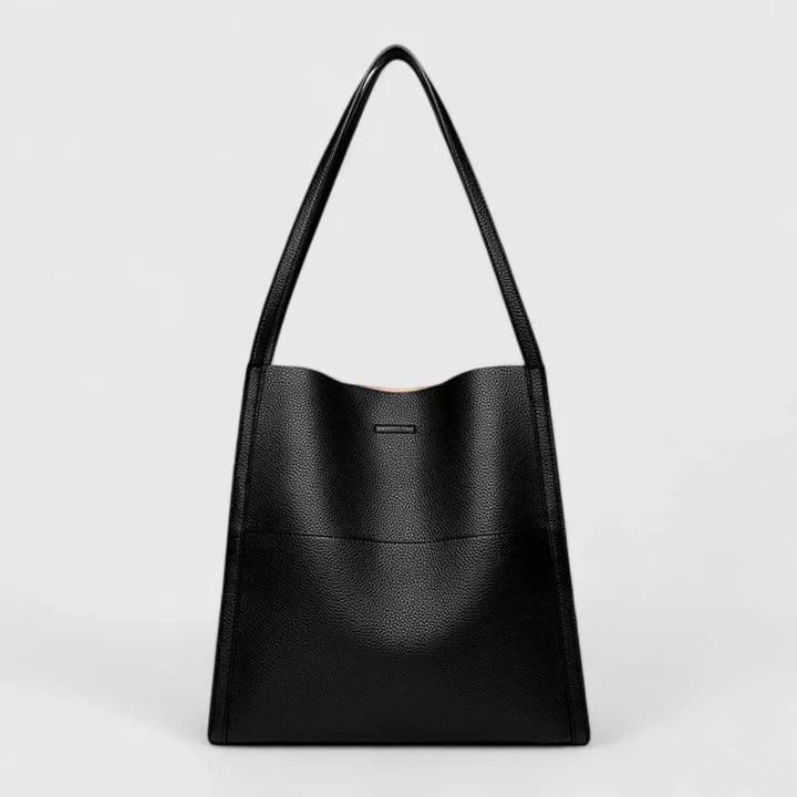 Eirunn structured handbag in red showcasing bold color and modern minimalist design