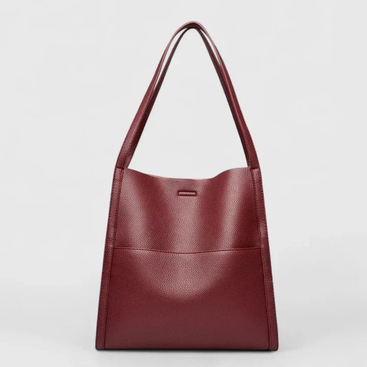 Overhead flat lay of Eirunn structured handbag showing interior compartment capacity