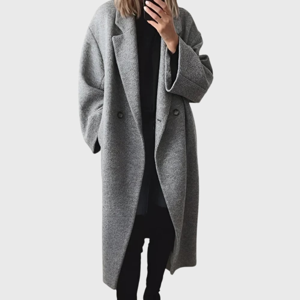 Woman wearing the Elda cozy longline overcoat in a relaxed silhouette, shown from the front