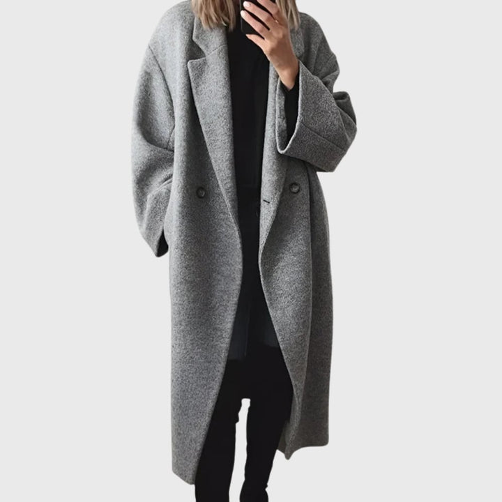 Woman wearing the Elda cozy longline overcoat in a relaxed silhouette, shown from the front
