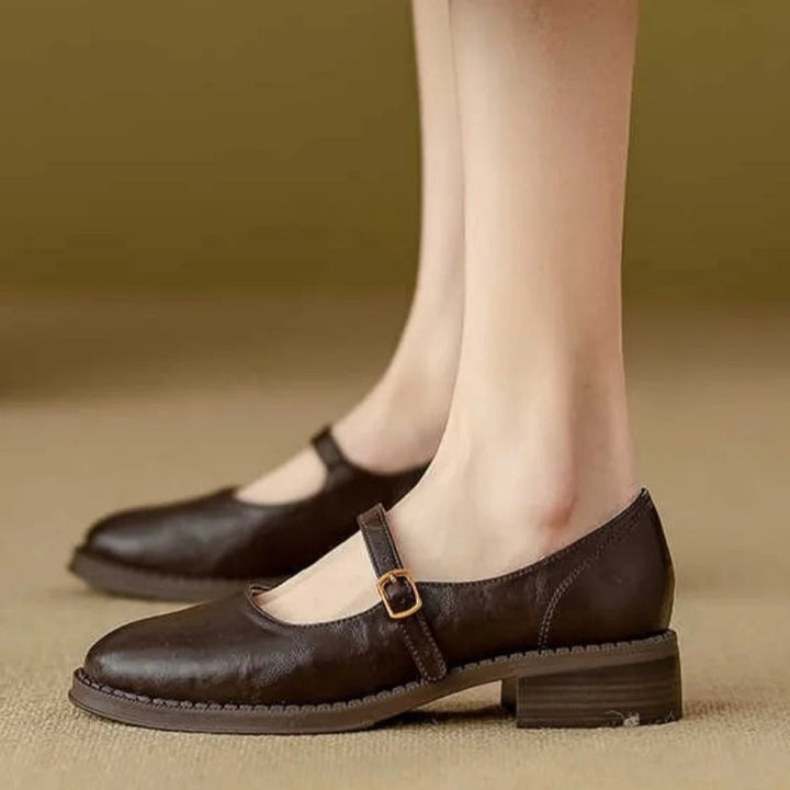 Side view of Eleanor mary jane shoes in black showing buckle strap and round toe