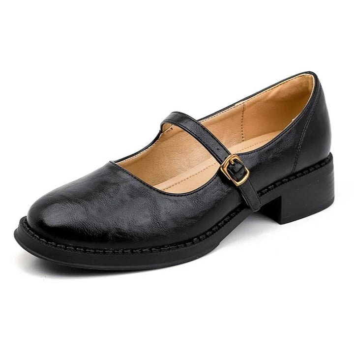 Pair of Eleanor mary jane shoes in black and brown side by side showing both colorways
