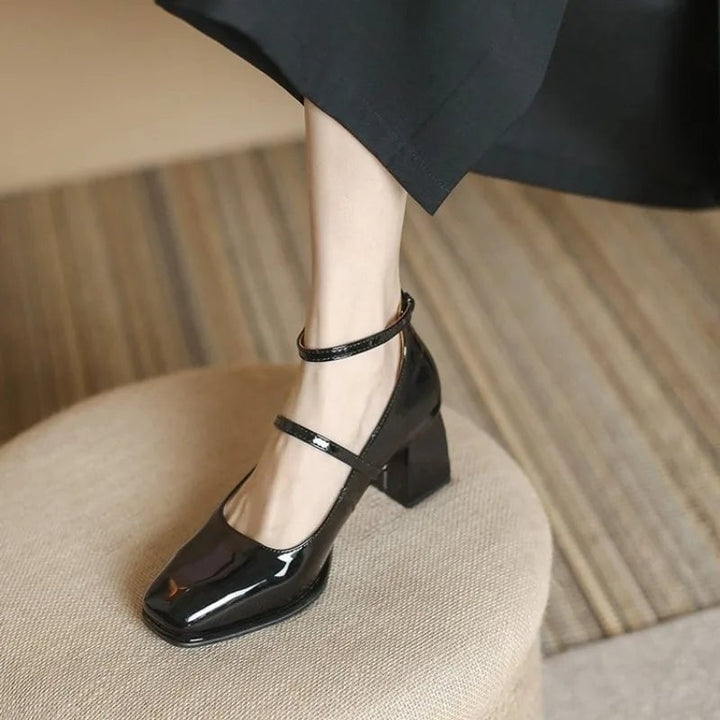 Celeste black ankle strap pump side profile highlighting mid-height block heel