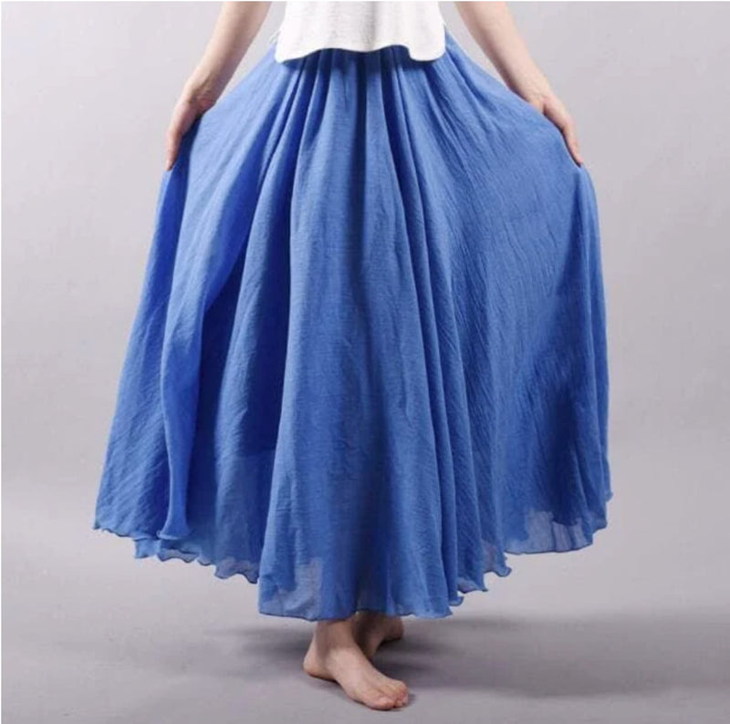 Model wearing the Eliana flowy summer skirt in blue, showing the long relaxed silhouette