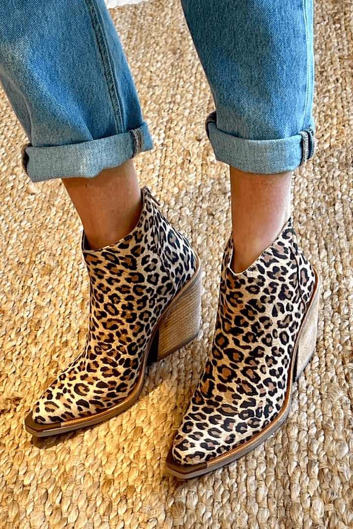 Close-up of brown Eliana cowboy boots showing pointed toe and western stitching
