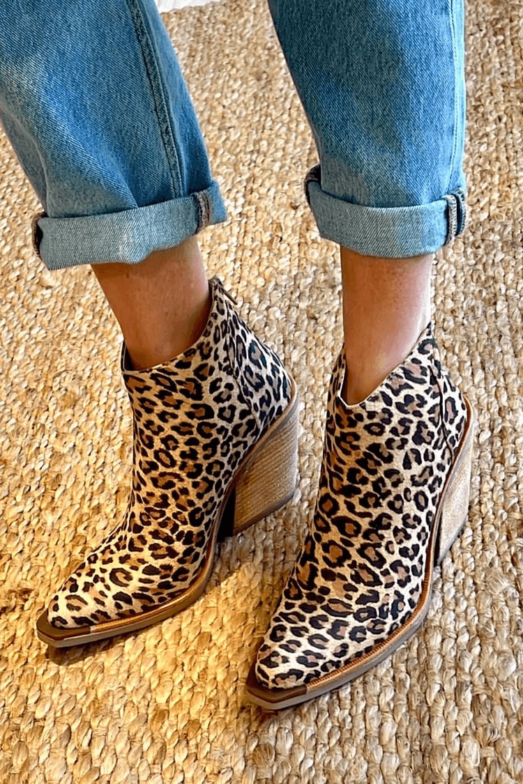 Close-up of brown Eliana cowboy boots showing pointed toe and western stitching